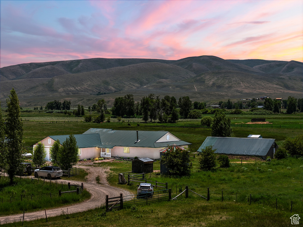 View of mountain backdrop featuring rural landscape