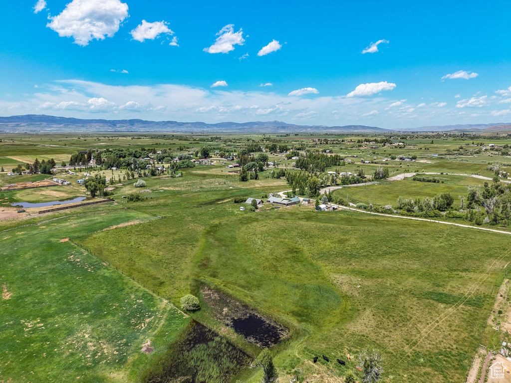 Aerial view of sparsely populated area with a mountain backdrop