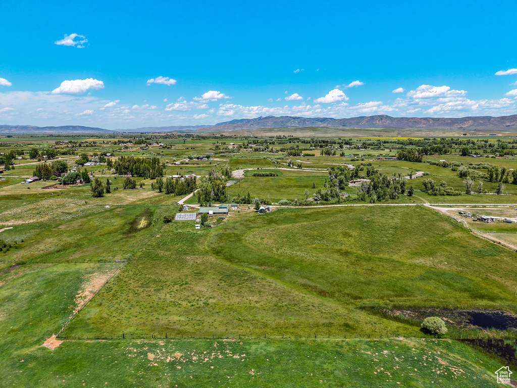 Overview of rural landscape with a mountain backdrop