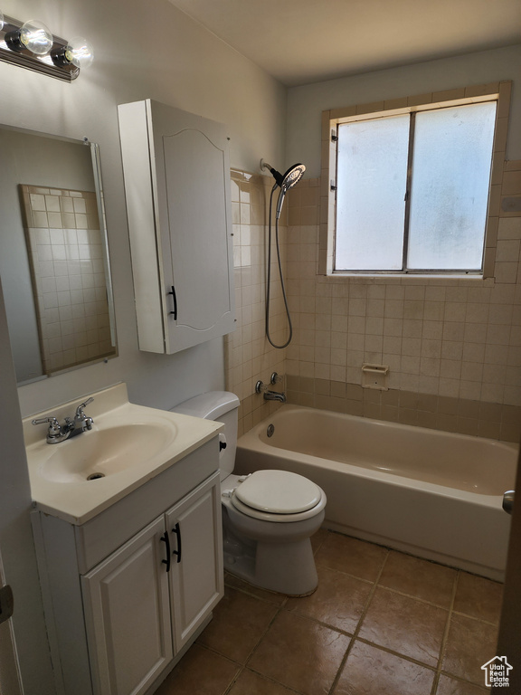 Full bath with vanity,  shower combination, and tile patterned floors