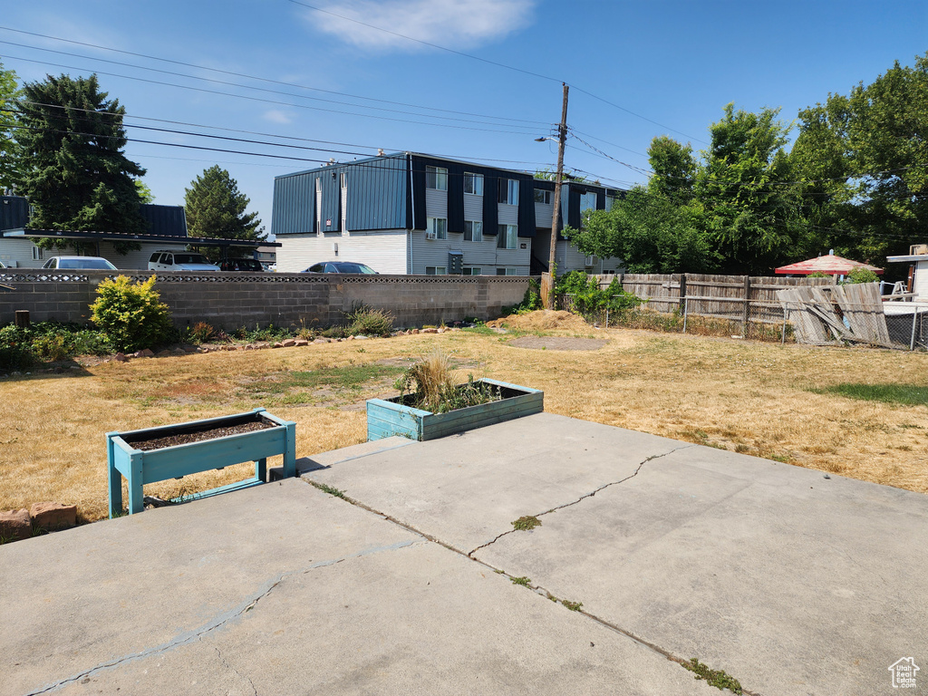 Fenced backyard featuring a patio