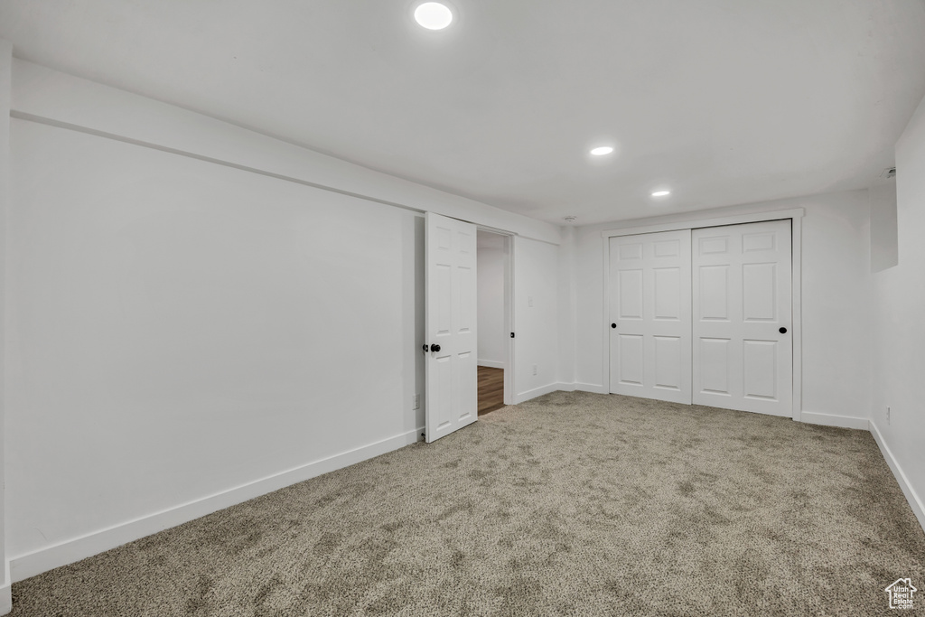 Unfurnished bedroom with carpet and recessed lighting