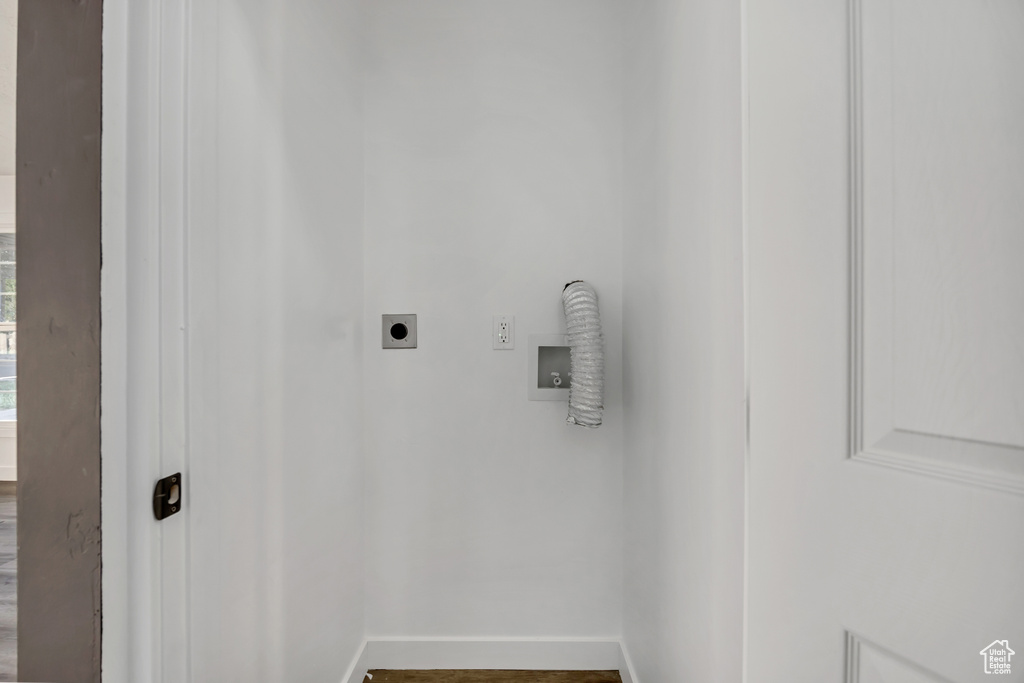 Laundry room with hookup for an electric dryer and hookup for a washing machine