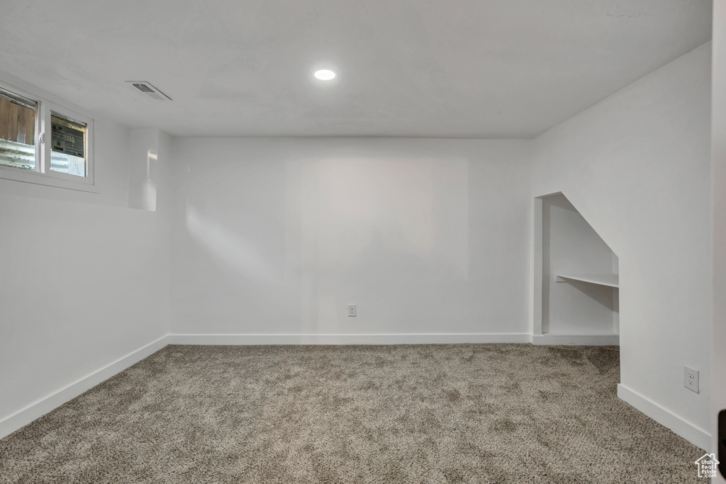Below grade area with carpet floors and recessed lighting
