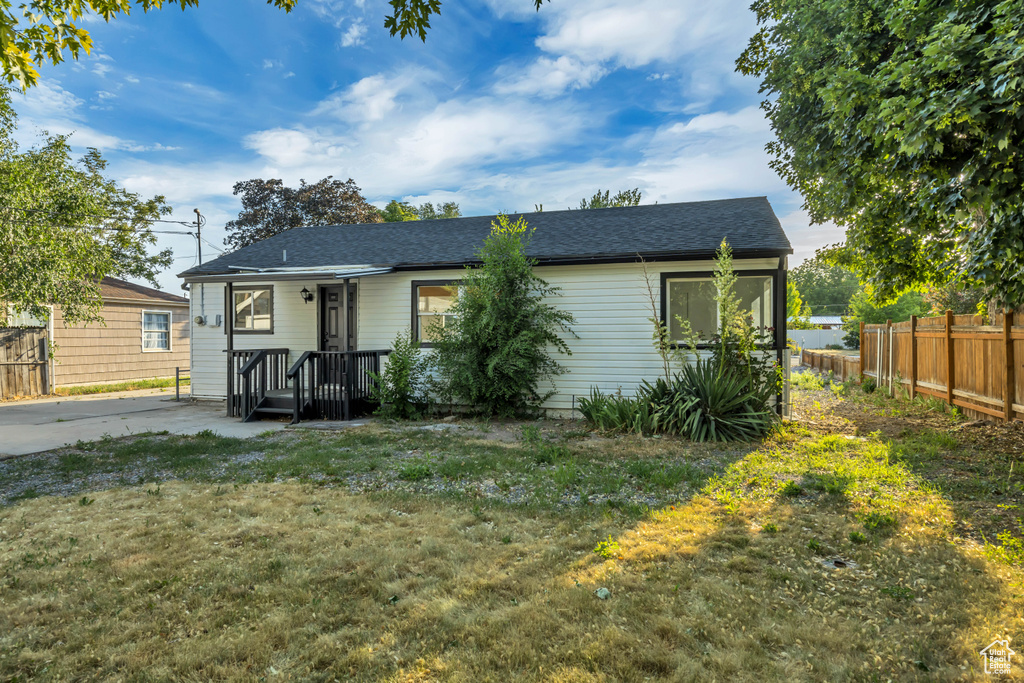 View of front of property with a shingled roof