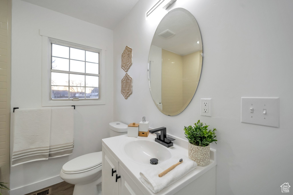 Bathroom with vanity and wood finished floors