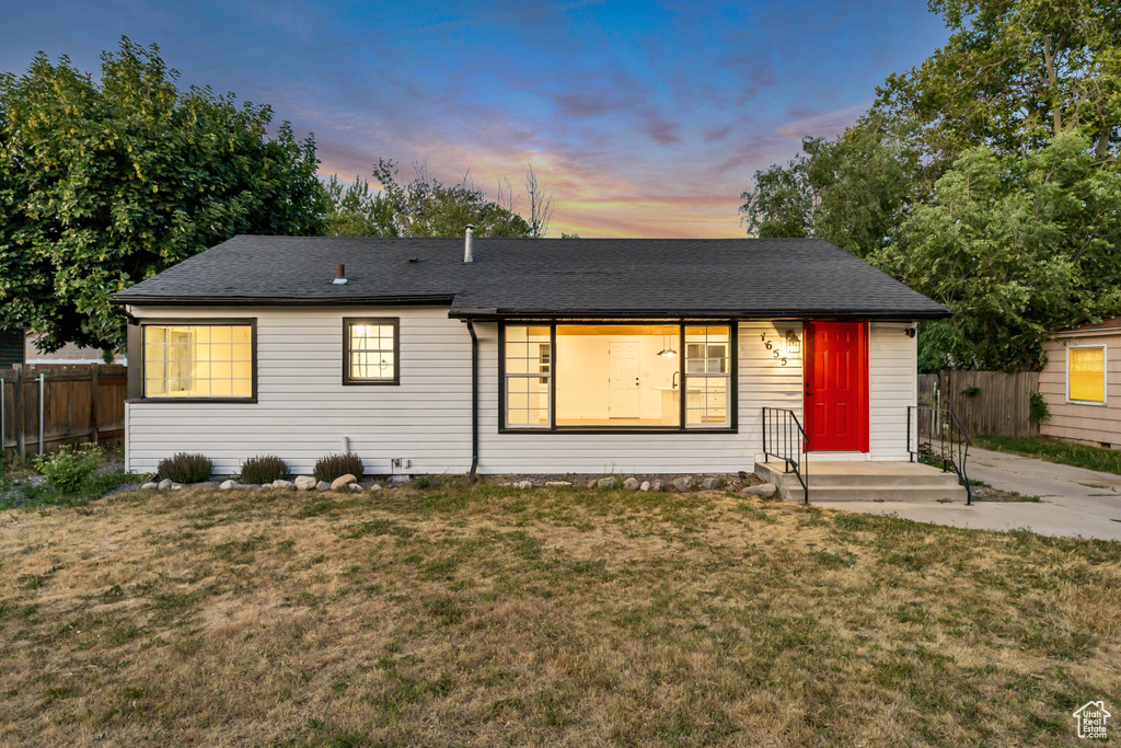 Single story home with roof with shingles