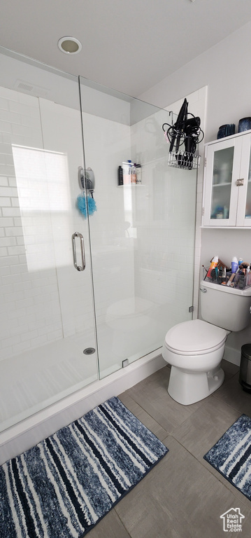 Full bathroom featuring a shower stall, wood finished floors, and recessed lighting