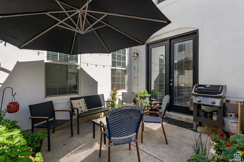 View of patio featuring a grill and an outdoor hangout area