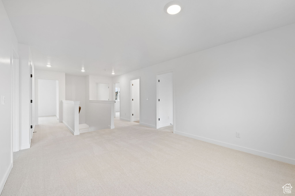 Spare room featuring light colored carpet