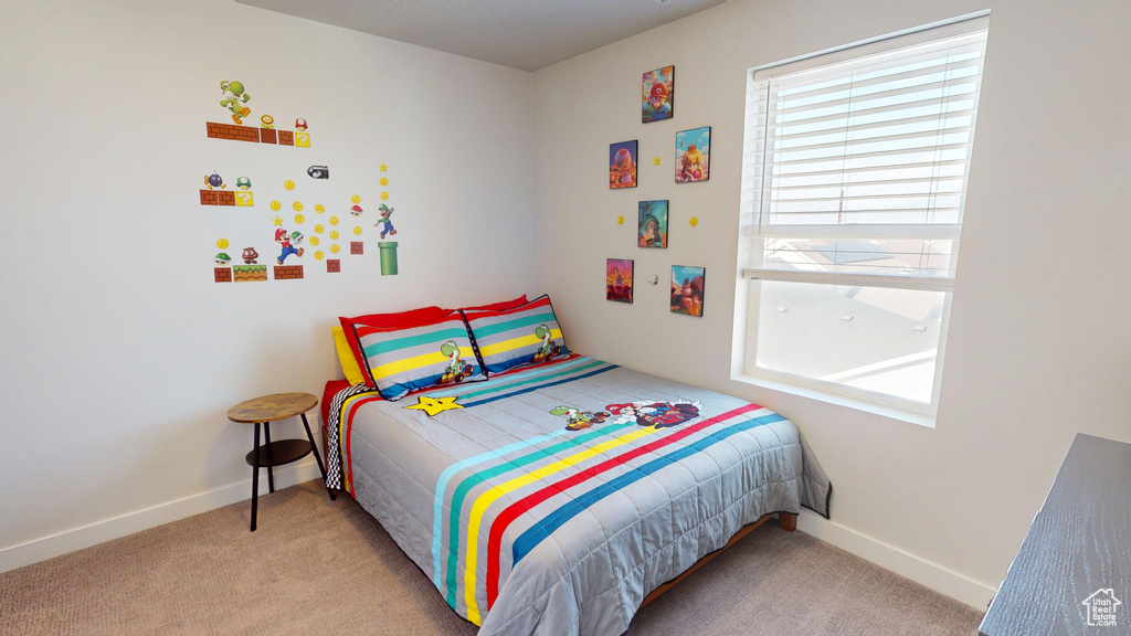 Bedroom with carpet floors and baseboards
