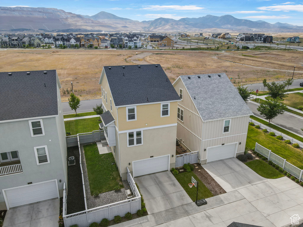 Aerial view of residential area with a mountain backdrop
