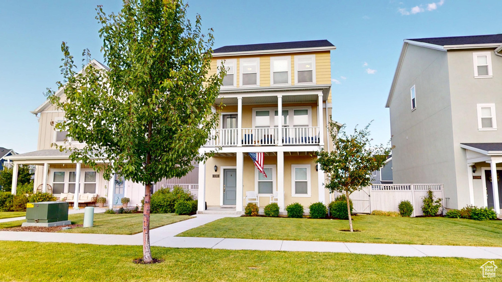View of property with a balcony