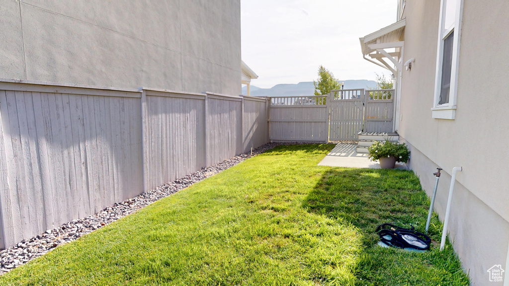 View of fenced backyard