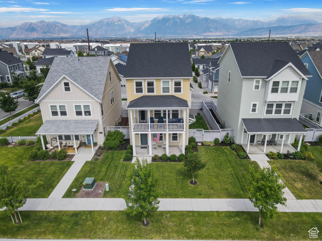 Aerial perspective of suburban area with a mountainous background