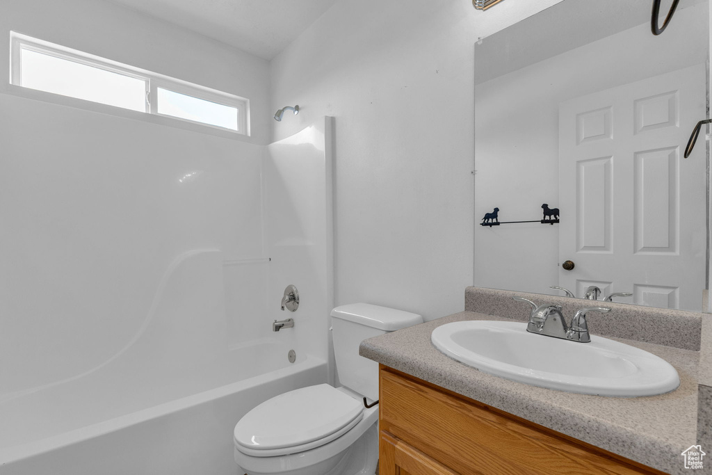 Bathroom with vanity and shower / tub combination