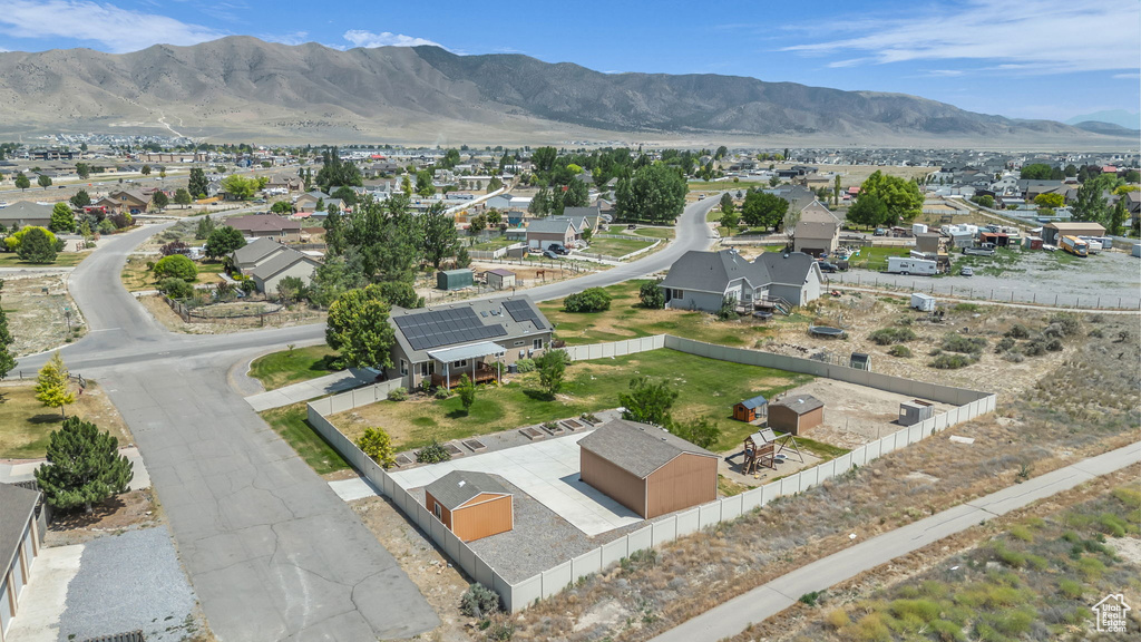 Aerial perspective of suburban area with a mountainous background