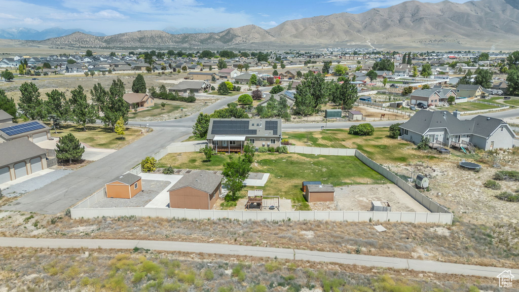 Aerial view of residential area featuring a mountainous background
