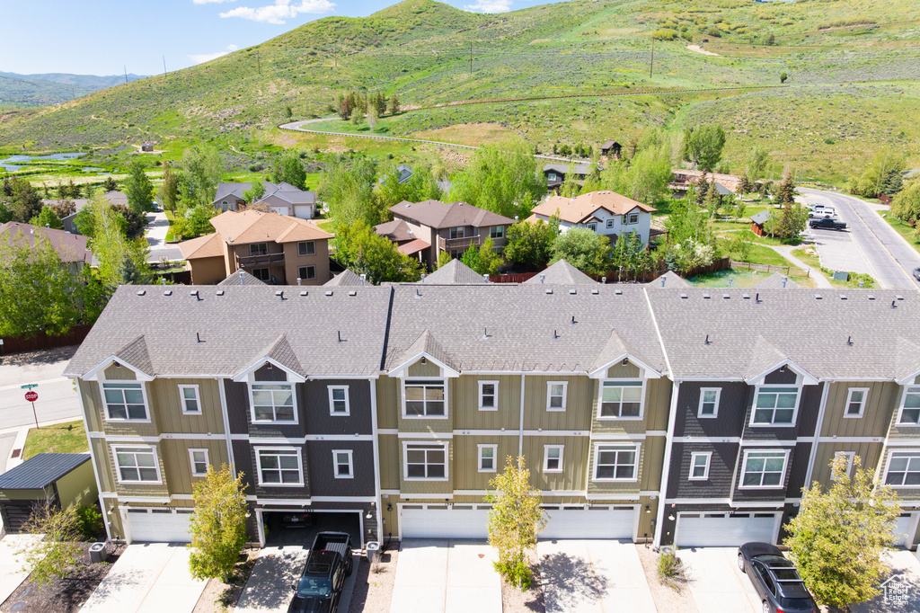 Aerial view of residential area featuring mountains