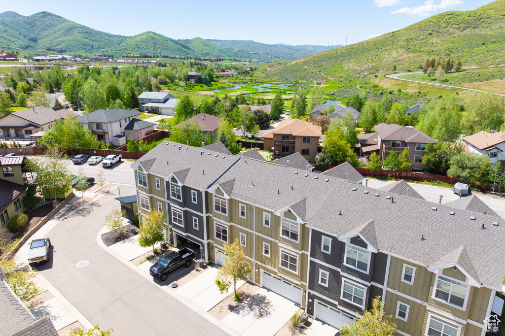 Aerial perspective of suburban area with a mountain backdrop