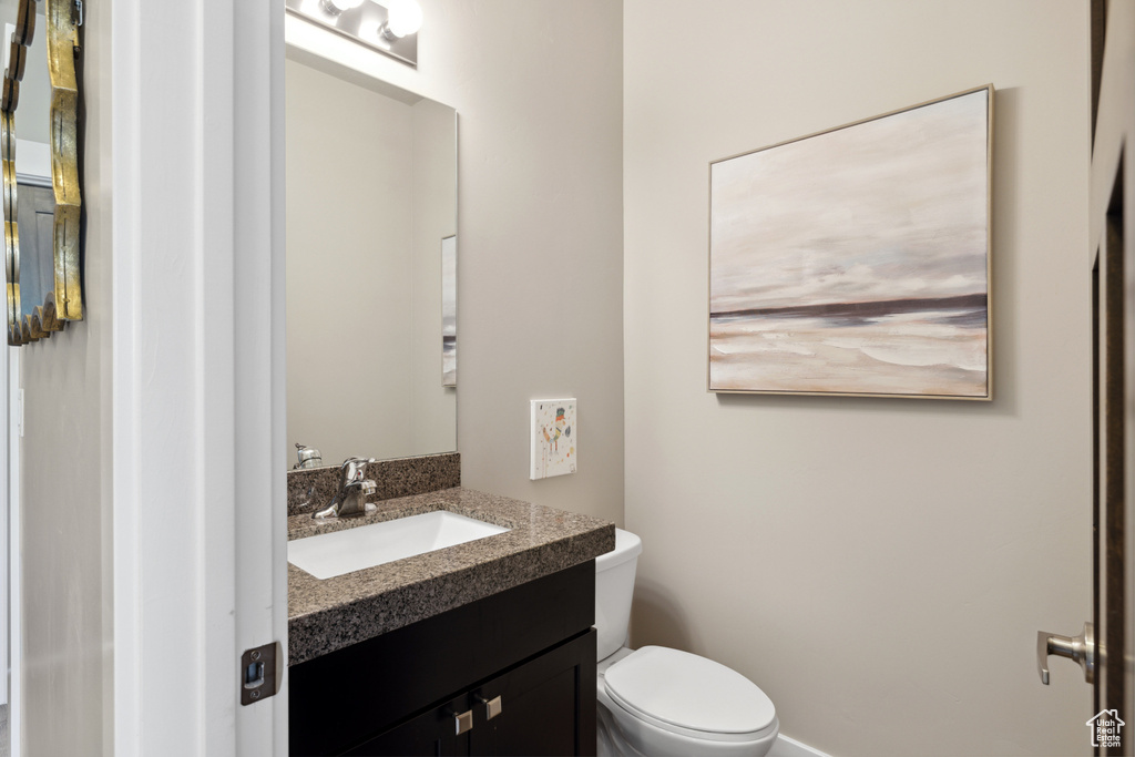 Bathroom featuring vanity and toilet