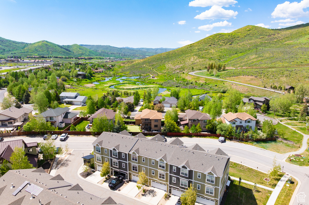 Aerial perspective of suburban area featuring a water and mountain view