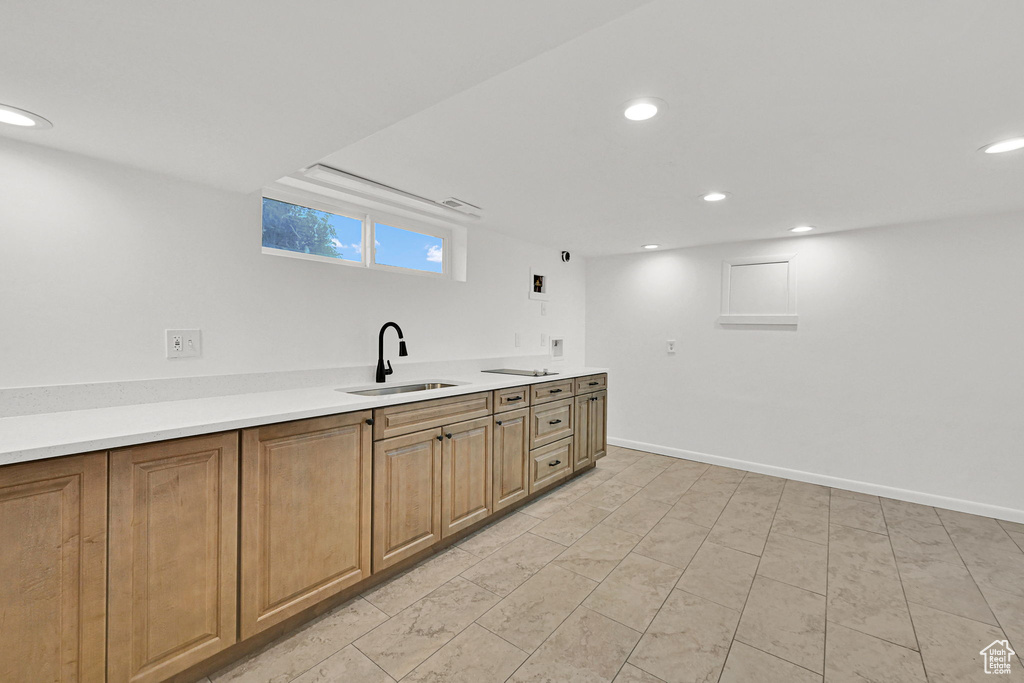 Kitchen with recessed lighting and light countertops