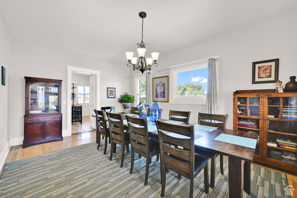 Dining area featuring a chandelier and light wood-style floors