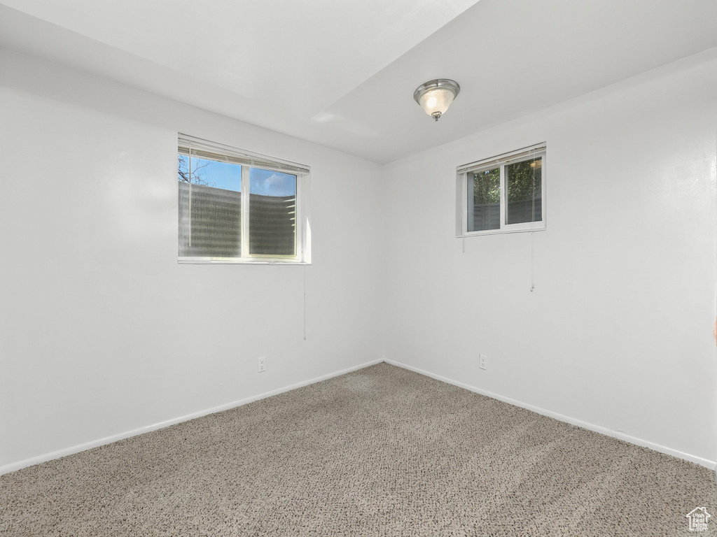 Carpeted empty room with plenty of natural light