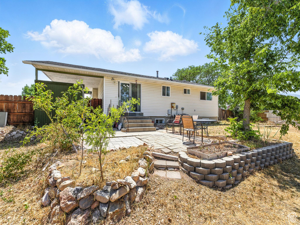 Rear view of property with a patio