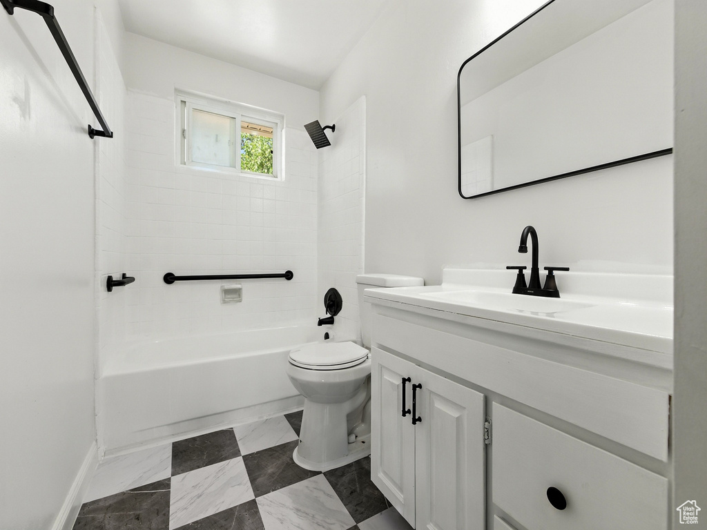 Bathroom featuring vanity and bathing tub / shower combination