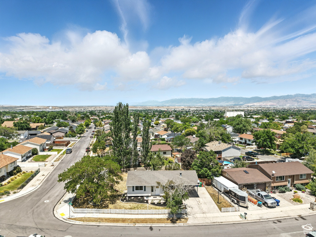 Aerial view of residential area with a mountainous background