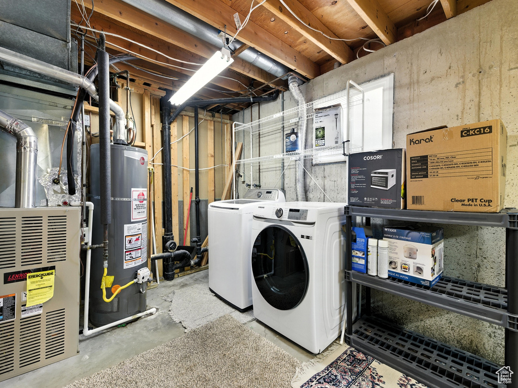Washroom with gas water heater, separate washer and dryer, and heating unit