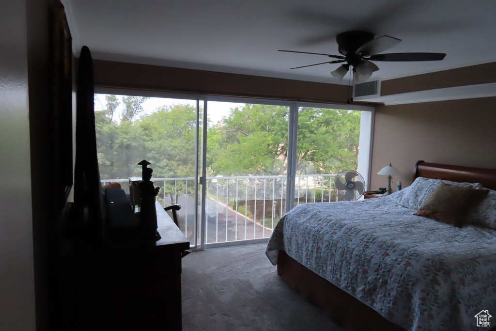 Bedroom with multiple windows and ceiling fan