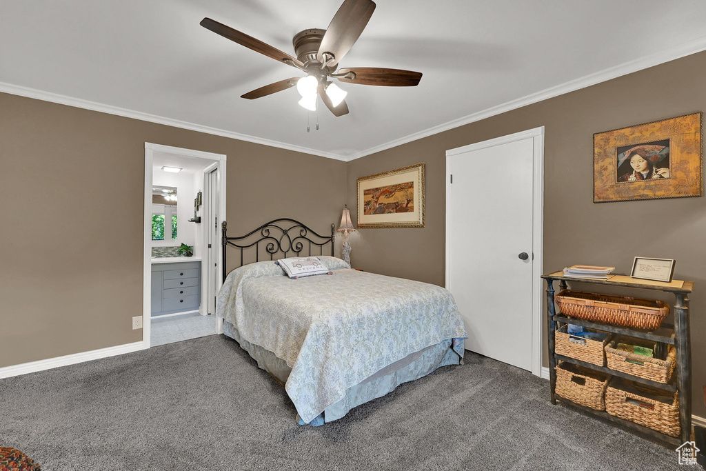 Bedroom featuring carpet floors, crown molding, a ceiling fan, and ensuite bath
