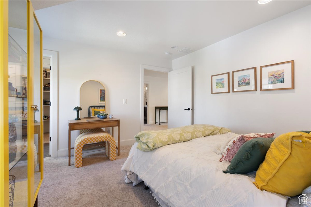 Carpeted bedroom featuring a closet and recessed lighting
