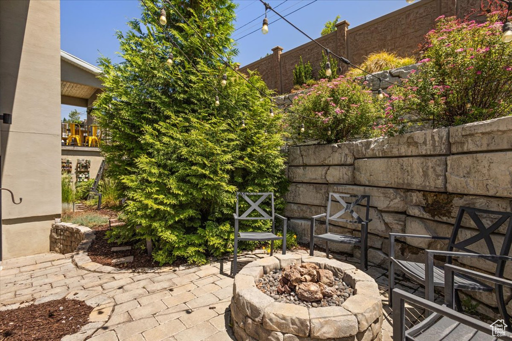 View of patio / terrace featuring an outdoor fire pit