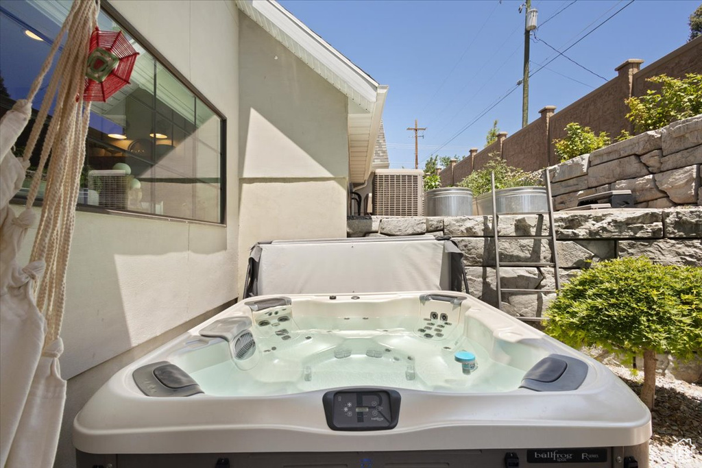 View of patio / terrace with a hot tub