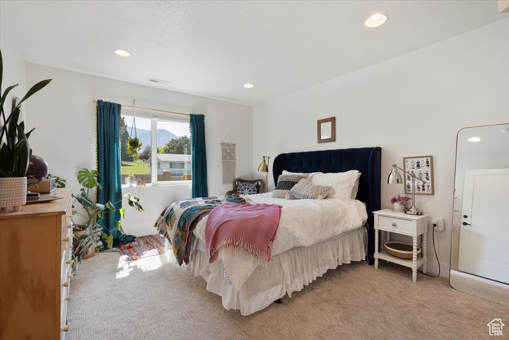 Bedroom featuring light carpet and recessed lighting