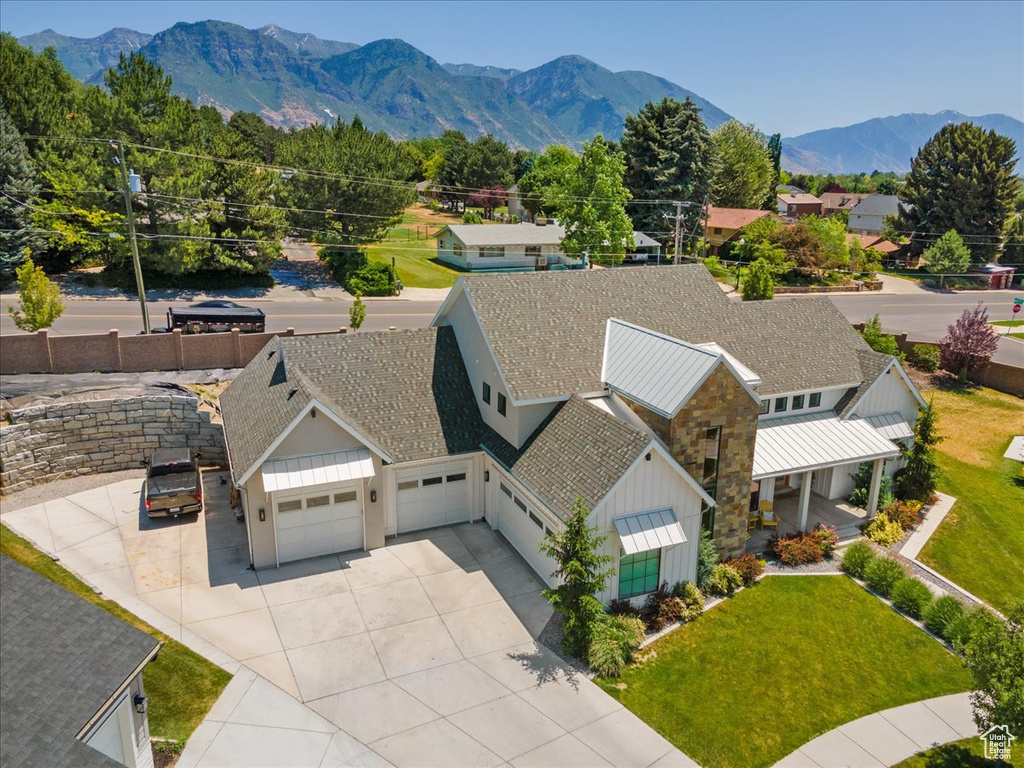 View from above of property with a mountain backdrop