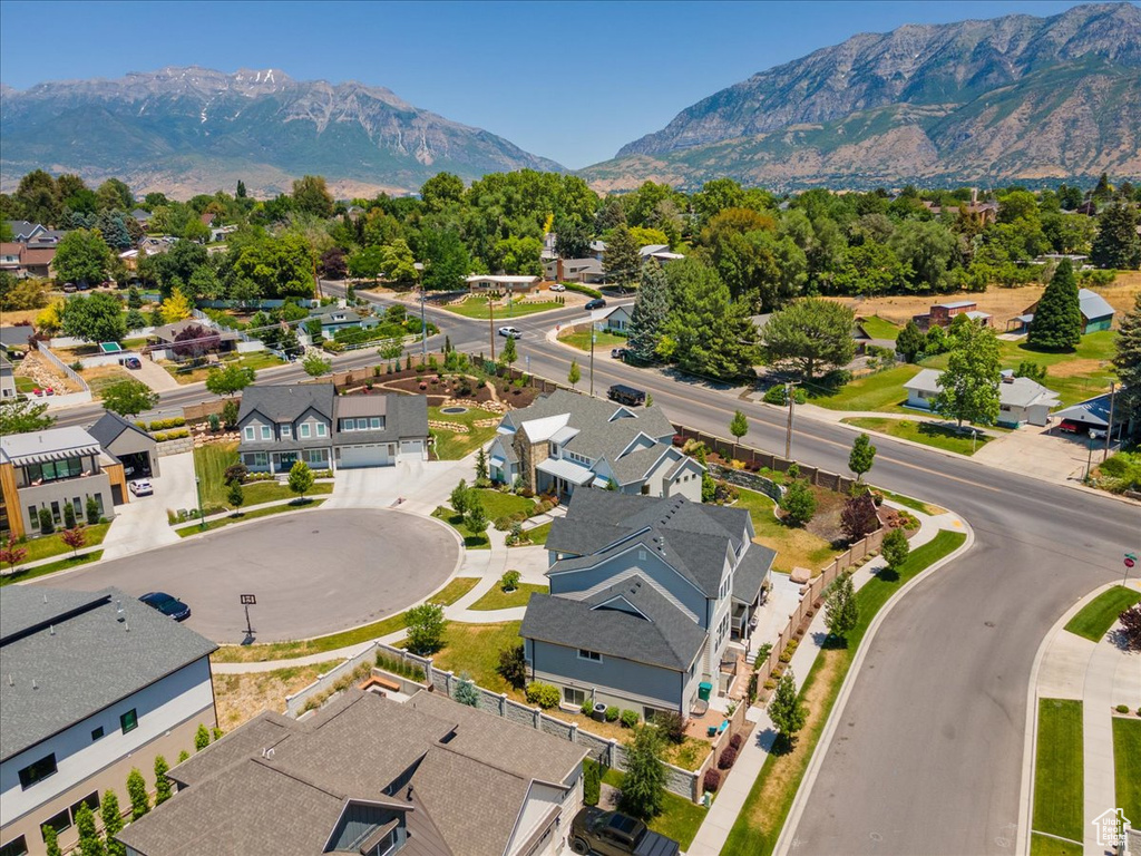 Aerial perspective of suburban area with a mountain backdrop