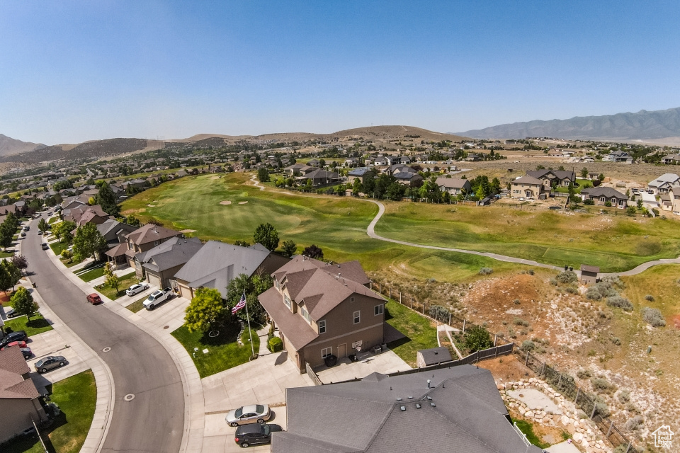 View of property location featuring nearby suburban area and a mountainous background