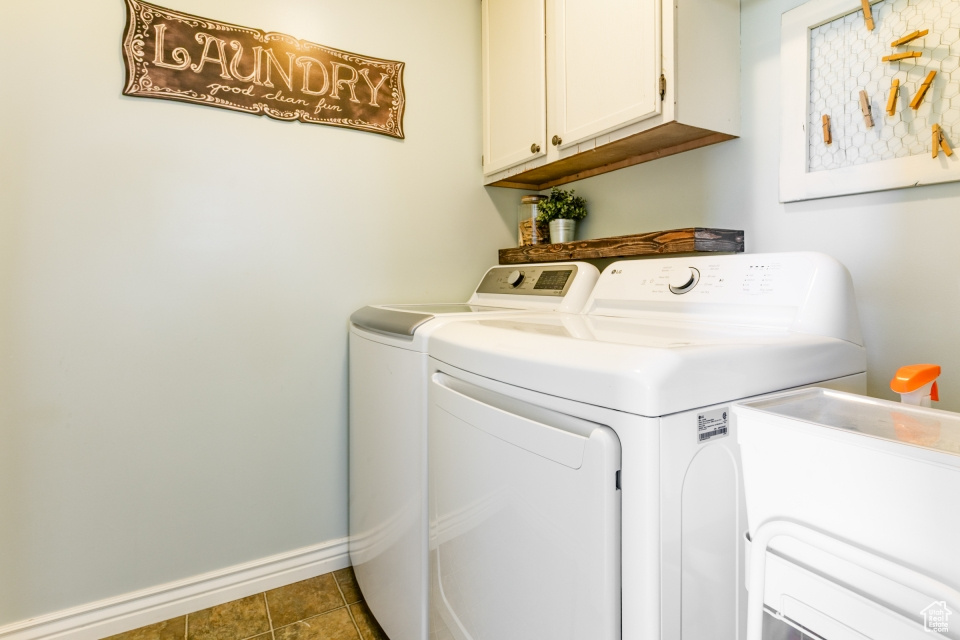 Laundry room with washing machine and dryer and cabinet space