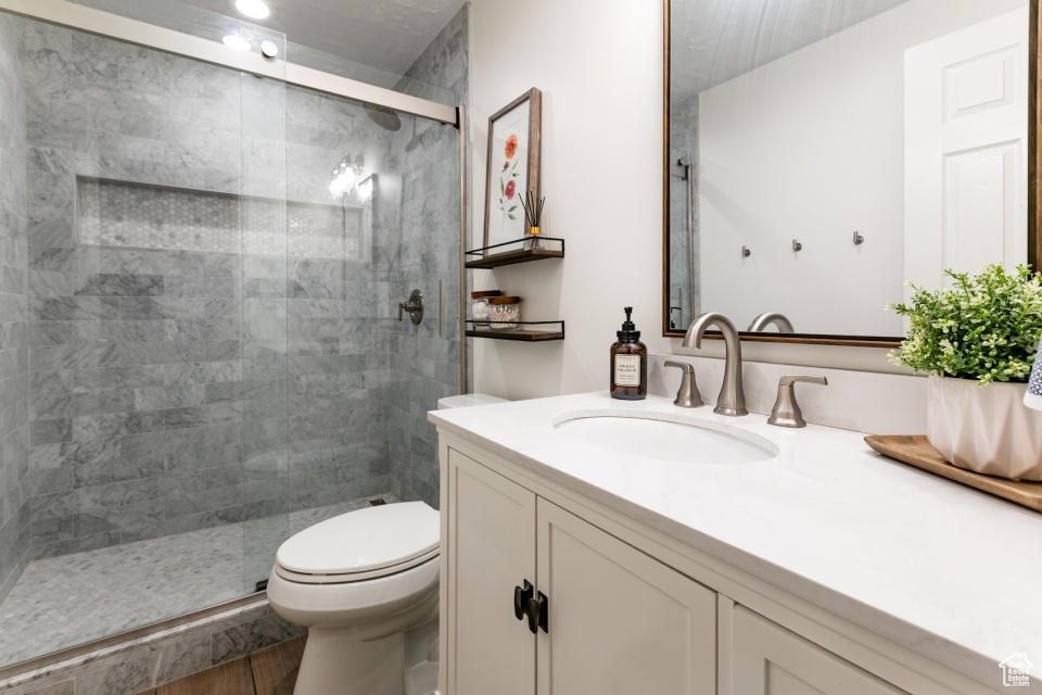 Full bathroom featuring vanity and a stall shower