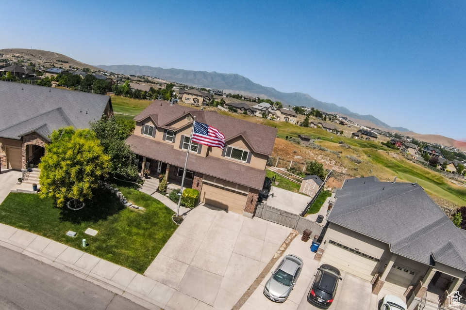 Aerial perspective of suburban area with a mountain backdrop