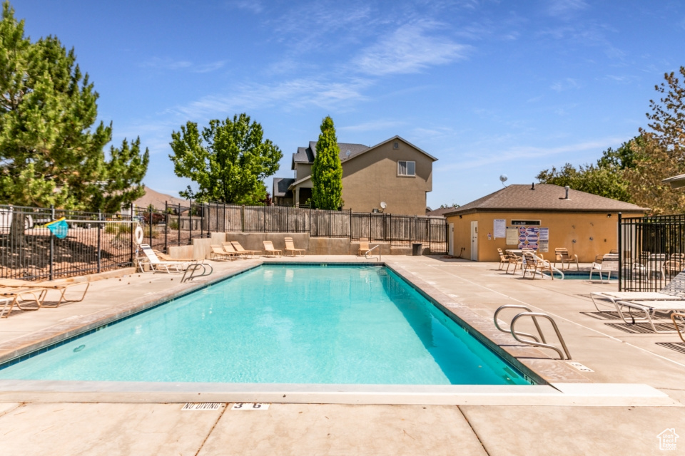Community pool featuring a patio area