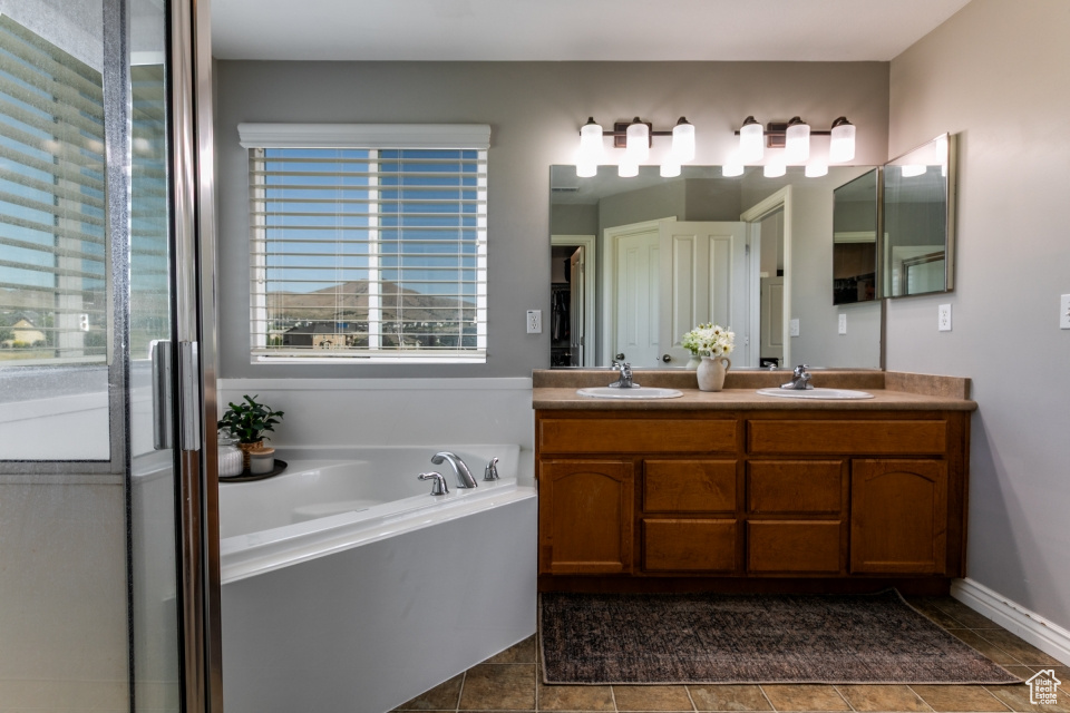 Bathroom with double vanity and a garden tub