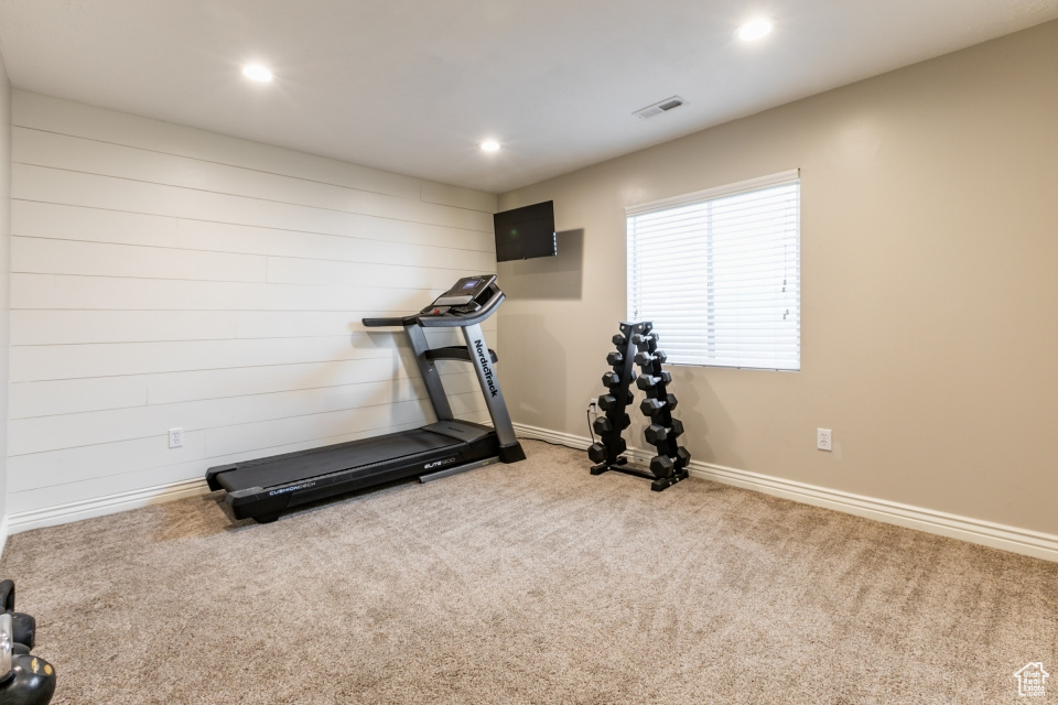 Workout room with carpet flooring and recessed lighting