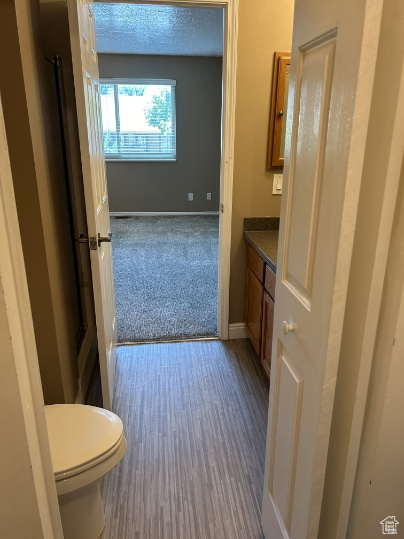 Bathroom with vanity and baseboards