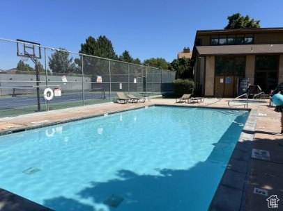 Community pool featuring a patio area